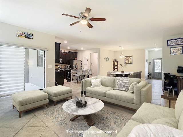 living area with recessed lighting, ceiling fan, and light tile patterned flooring