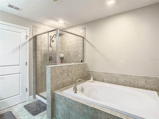 bathroom featuring visible vents, tile patterned flooring, a shower stall, a bath, and recessed lighting