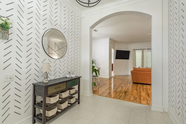 hallway featuring light hardwood / wood-style floors and ornamental molding