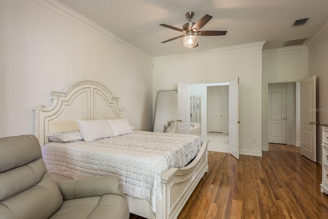 bedroom featuring ceiling fan, ornamental molding, and dark hardwood / wood-style floors