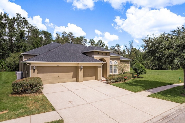 view of front facade featuring a front yard and a garage