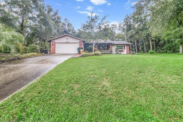 ranch-style house with a front yard and a garage