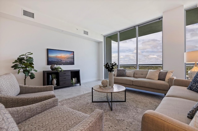 living room featuring floor to ceiling windows