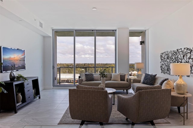 living room featuring a wall of windows