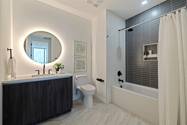 full bathroom featuring vanity, shower / bath combo, and toilet