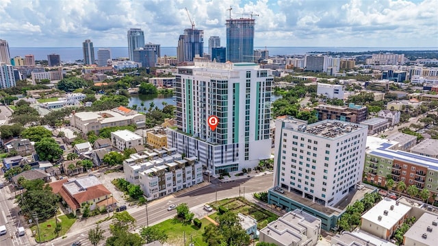 birds eye view of property with a water view