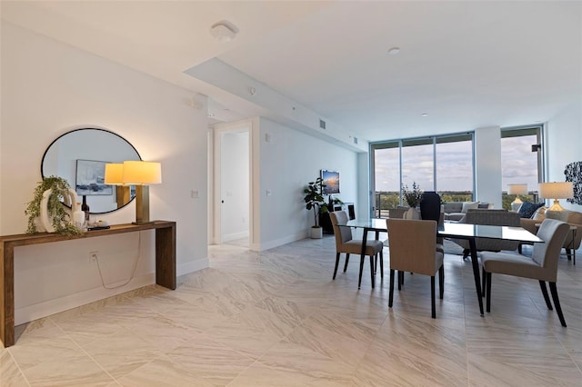 dining area with a wall of windows