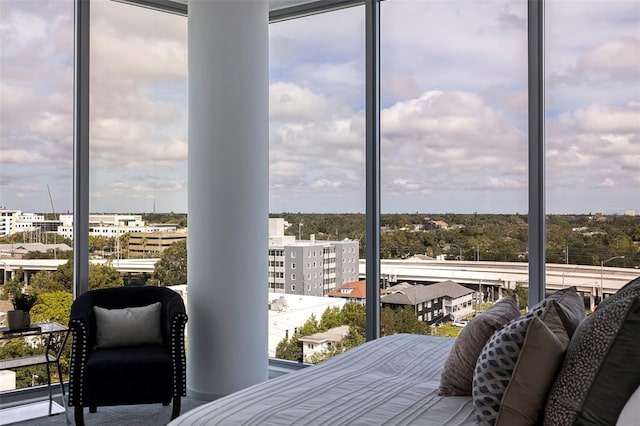 bedroom with floor to ceiling windows