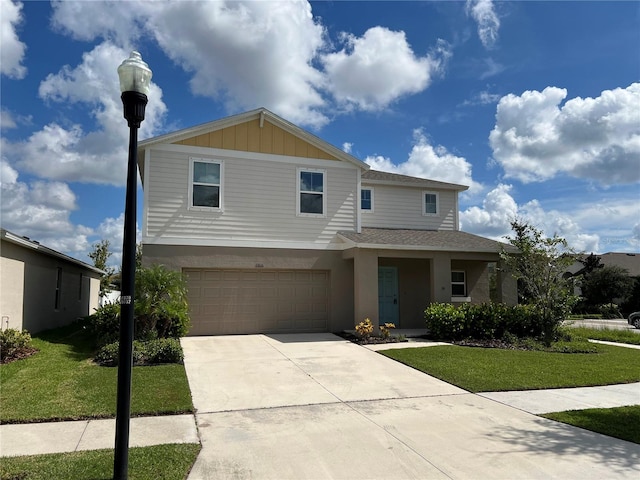 view of front of property featuring a garage and a front lawn