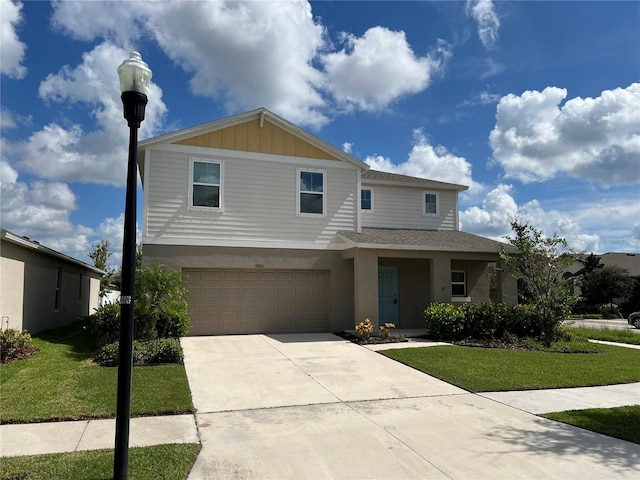view of front of house featuring a front yard, an attached garage, board and batten siding, and concrete driveway