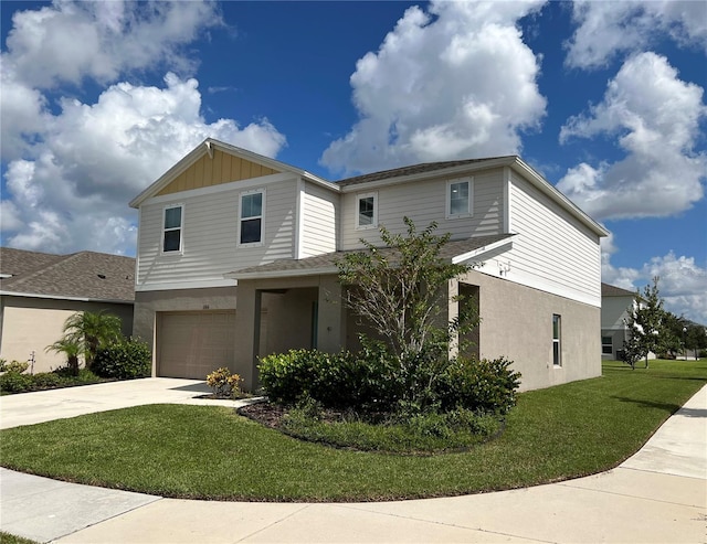 multi unit property with a front yard, a garage, board and batten siding, concrete driveway, and stucco siding