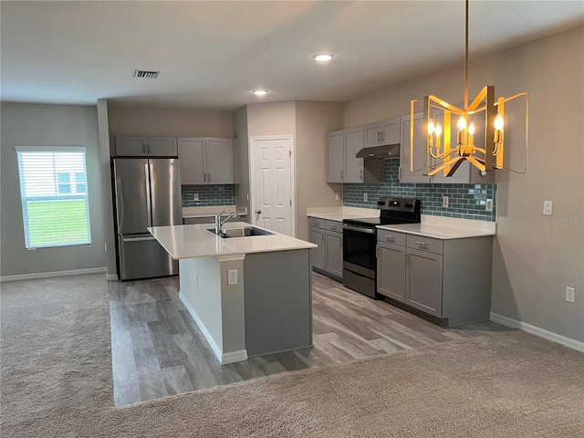kitchen featuring a sink, gray cabinets, appliances with stainless steel finishes, and visible vents