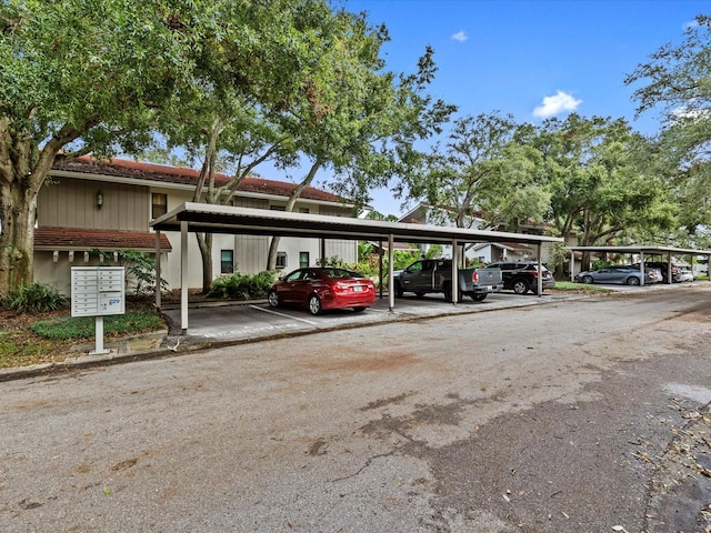 view of parking / parking lot featuring a carport