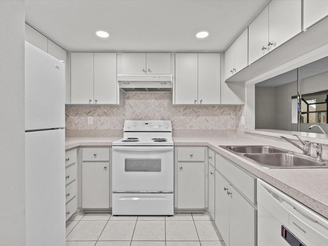 kitchen with decorative backsplash, light tile patterned flooring, white cabinets, white appliances, and sink