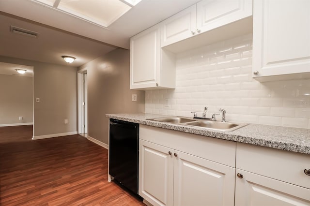 kitchen featuring white cabinetry, backsplash, dishwasher, hardwood / wood-style flooring, and sink