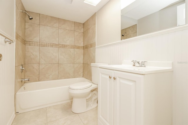 full bathroom with tiled shower / bath, vanity, tile patterned flooring, and toilet