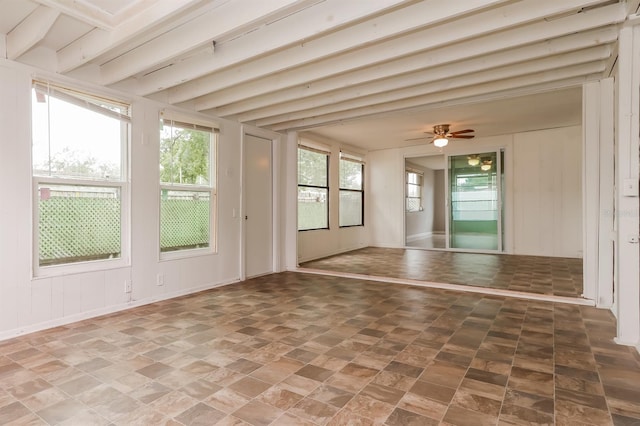 spare room featuring a wealth of natural light and ceiling fan