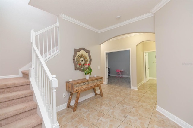 stairs with ornamental molding and tile patterned flooring