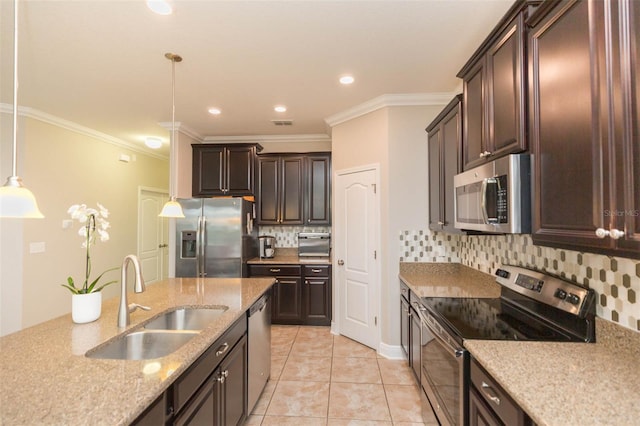 kitchen with pendant lighting, sink, stainless steel appliances, backsplash, and crown molding