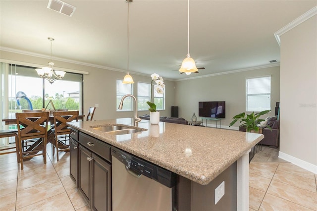 kitchen featuring light stone counters, dishwasher, pendant lighting, a center island with sink, and sink