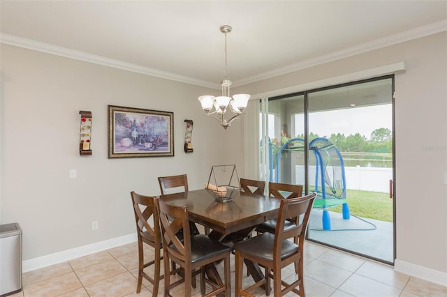 tiled dining area with ornamental molding and an inviting chandelier