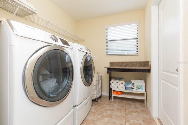 laundry area with light tile patterned floors and independent washer and dryer