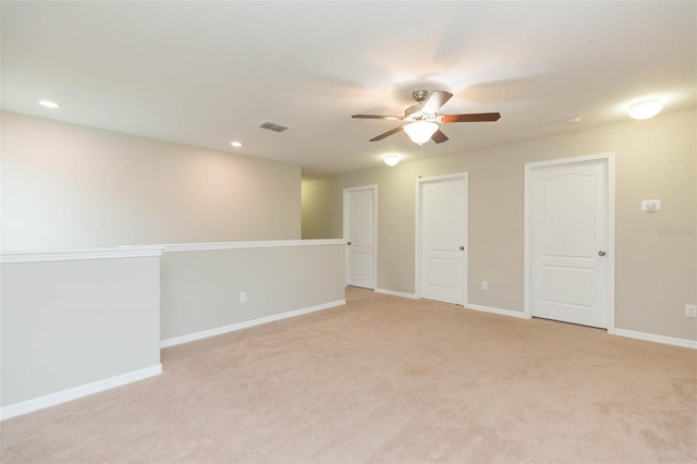 carpeted empty room with ceiling fan