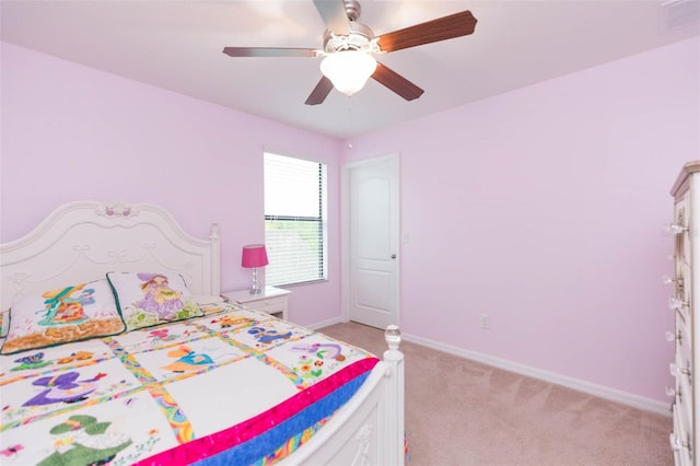 bedroom with ceiling fan and light colored carpet