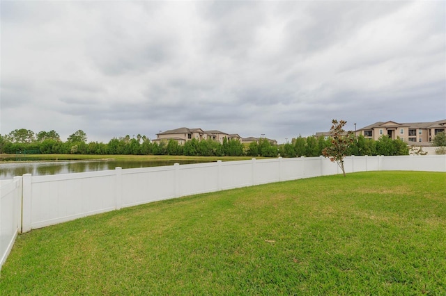 view of yard with a water view