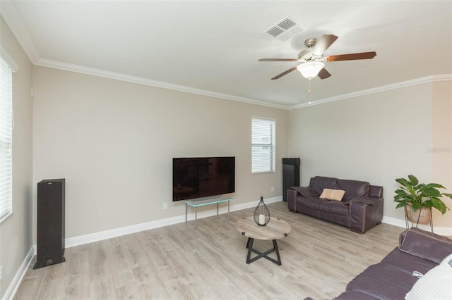 living room with ceiling fan, light wood-type flooring, and ornamental molding