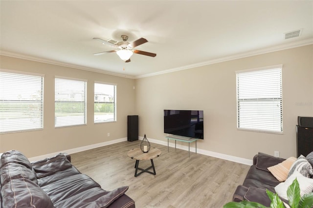 living room with crown molding, light hardwood / wood-style floors, and ceiling fan