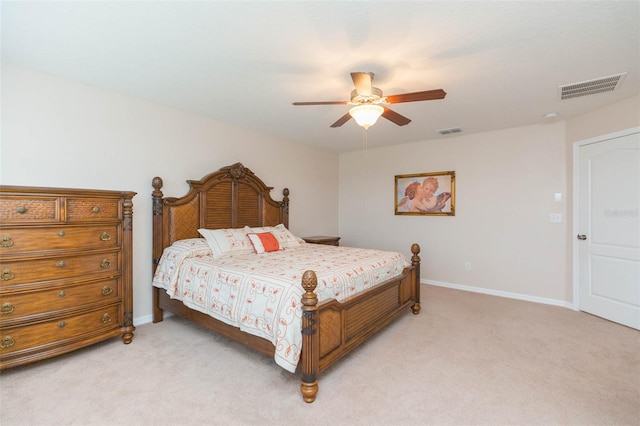 bedroom featuring ceiling fan and light carpet