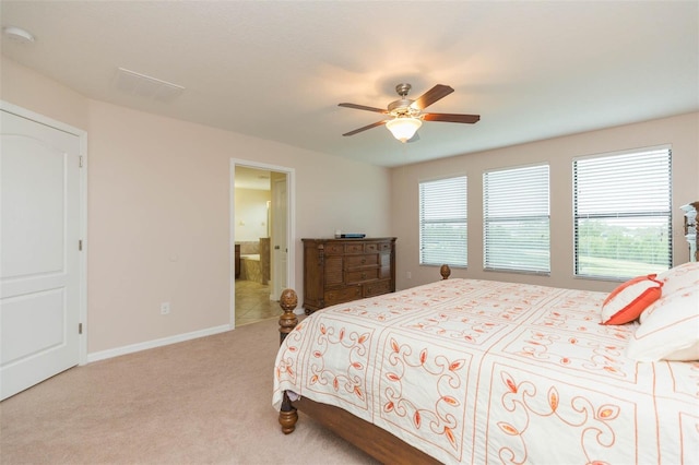 carpeted bedroom featuring ceiling fan and connected bathroom