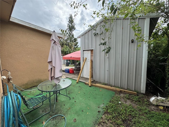 view of patio / terrace featuring a shed