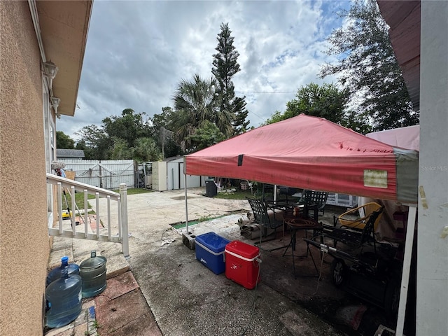 view of patio with a shed