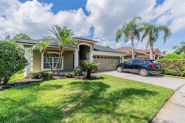 view of front of home featuring a garage and a front yard