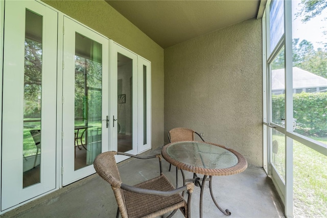 sunroom with french doors and a healthy amount of sunlight