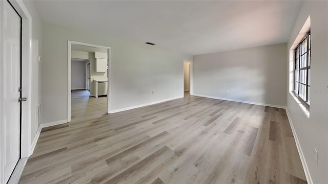 unfurnished room featuring light wood-type flooring