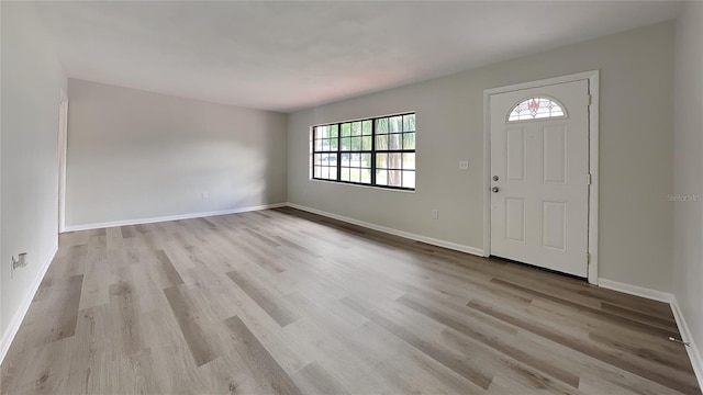 entryway with light hardwood / wood-style floors