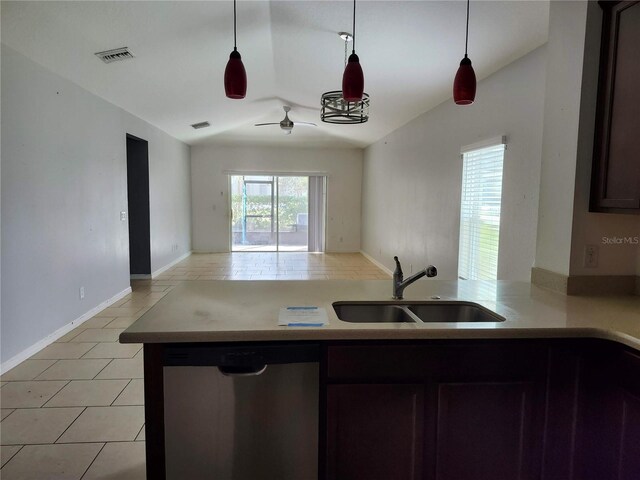 kitchen featuring lofted ceiling, sink, pendant lighting, and dishwasher