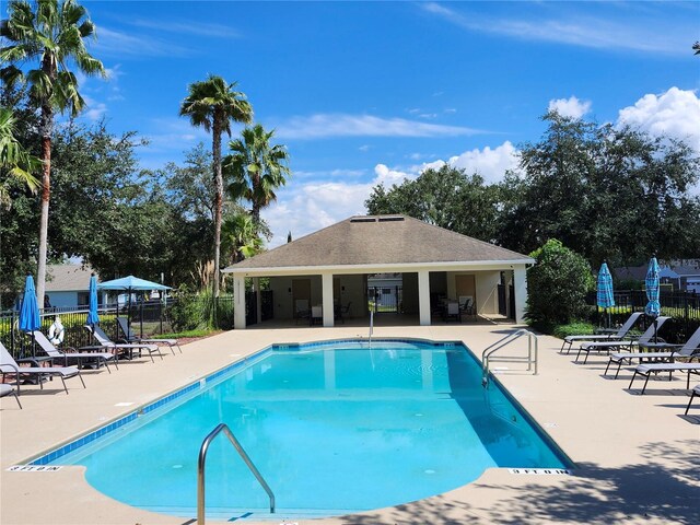 view of swimming pool with a patio