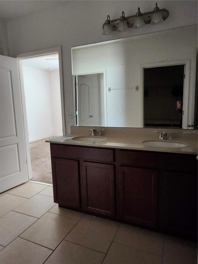 bathroom with vanity and tile patterned flooring