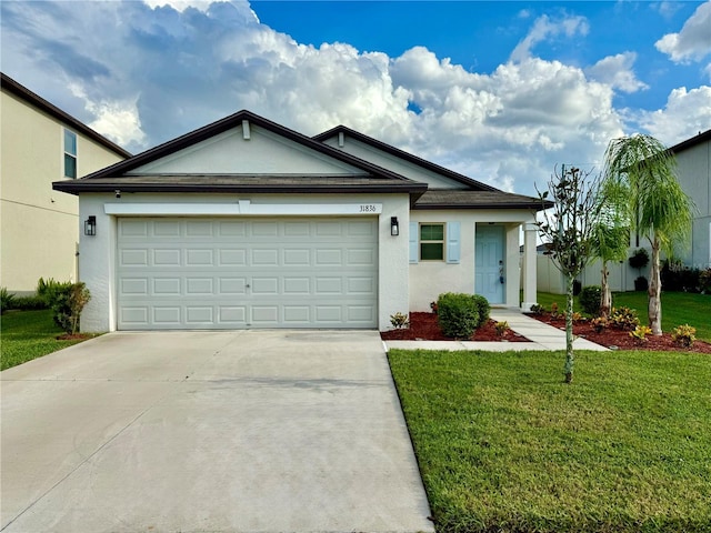 ranch-style house featuring a garage and a front yard