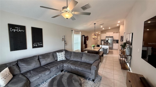 tiled living room with vaulted ceiling and ceiling fan