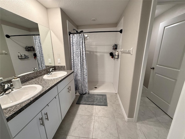 bathroom with tile patterned flooring, vanity, and a shower with curtain