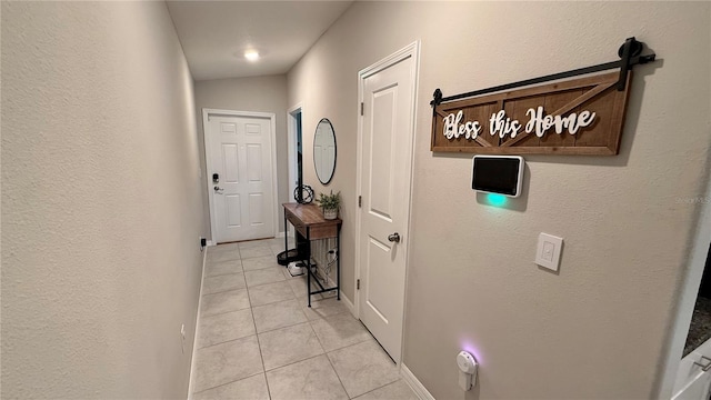 hallway featuring light tile patterned floors