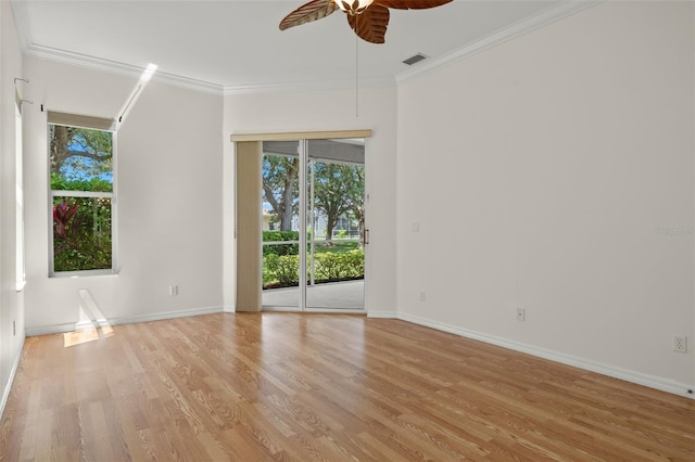 empty room featuring ornamental molding, ceiling fan, and light hardwood / wood-style flooring