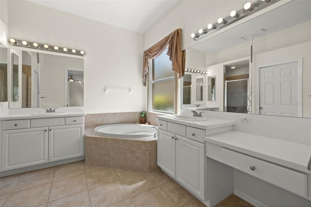 bathroom with tile patterned floors, ceiling fan, separate shower and tub, and vanity