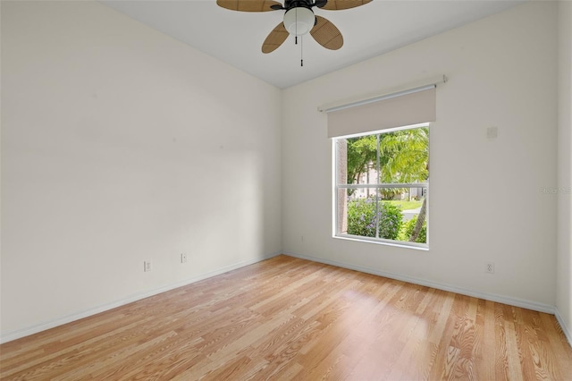 unfurnished room with ceiling fan and light wood-type flooring