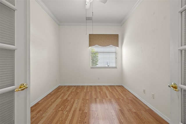 empty room with crown molding, ceiling fan, and light hardwood / wood-style flooring